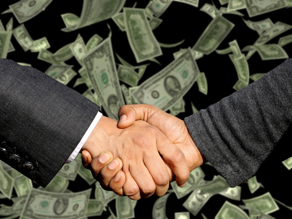 corporate sponsorship partnership handshake business